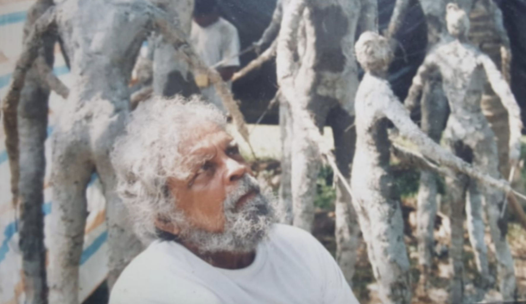 Tilake Abeysinghe among his sculptures